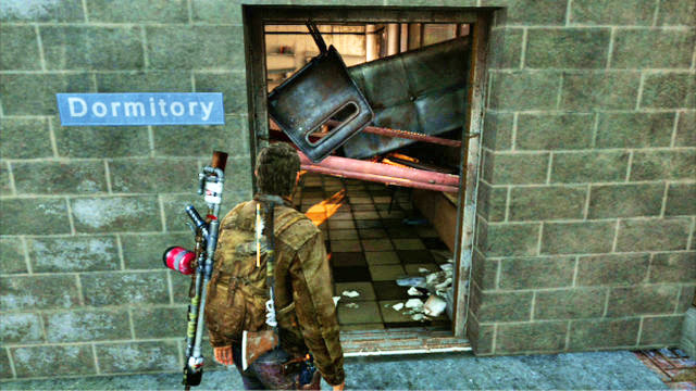The path will take you to a locked gate, which you can get around by squeezing through the barricaded door to the right - The Last of Us: Go Big Horns! The University Walkthrough - The University - The Last of Us Guide
