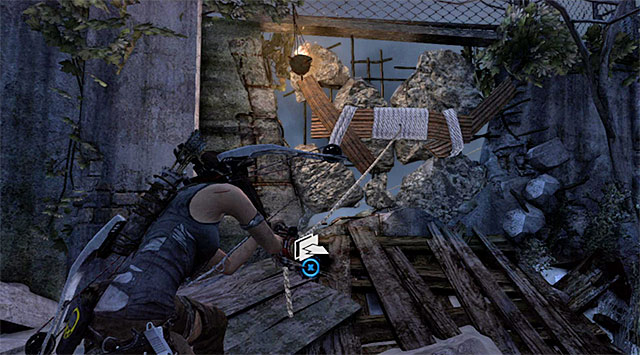 Youll have to use a rope arrow and the rope ascender again, this time to destroy the barricade on the left in order to unlock access to another rope bridge - Return to the Survivor Camp on the Beach | 22: Gone Missing Walkthrough - 22: Gone Missing | Walkthrough - Tomb Raider Game Guide