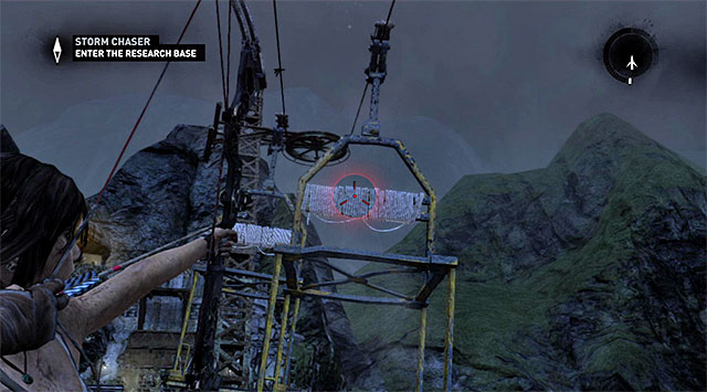 Use the bow and shoot the rope arrow towards the closer gondola cart (screen) in order to pull it towards you - Enter the Research Base | 23: Storm Chaser Walkthrough - 23: Storm Chaser | Walkthrough - Tomb Raider Game Guide