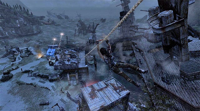 After Lara lands on the new ledge, approach the next line and grab it to slide down to survivors camp (reward: 100 XP) - Return to the Survivor Camp on the Beach | 23: Storm Chaser Walkthrough - 23: Storm Chaser | Walkthrough - Tomb Raider Game Guide