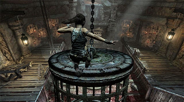 Be ready to action, because when the cage approaches the balcony occupied by you, youll have to make a jump towards it to safely land on the cage - Rescue Sam from Mathias (part 1) | 24: Going Back In Walkthrough - 24: Going Back In | Walkthrough - Tomb Raider Game Guide