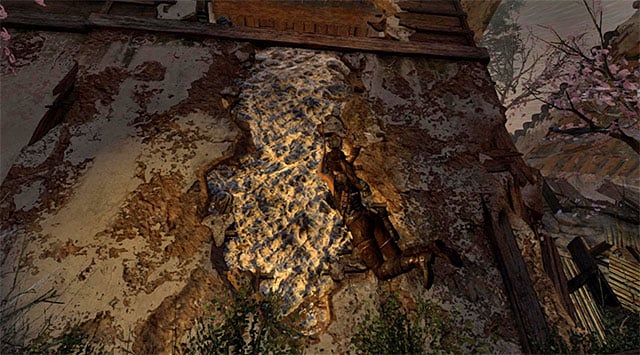 Make your way to the area around the searchlight; youre going to have to scramble up the wall using the climbing axe - Fight Your Way Out of the Palace | 17: Into the Fire Walkthrough - 17: Into the Fire | Walkthrough - Tomb Raider Game Guide