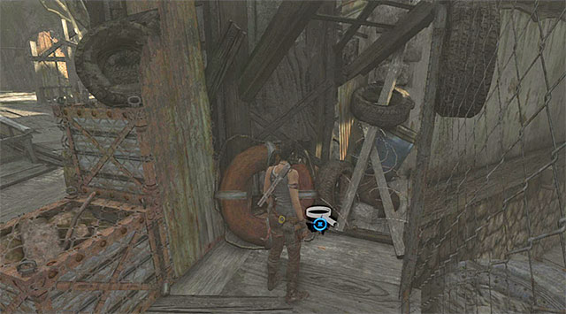 Approach the fence and look for the Cache on the ground (reward: 5 XP) - GPS Caches (08-15) | Collectibles: Shantytown - Collectibles: Shantytown - Tomb Raider Game Guide
