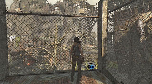 Once there, drop down and examine the area by the fence - GPS Caches (08-15) | Collectibles: Shantytown - Collectibles: Shantytown - Tomb Raider Game Guide