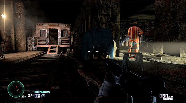 After you pass by the first car, turn towards the left part of the tunnel and walk around the second car on the left - Disarm the second bomb - Mission 7 - Transit Yards - Tom Clancys Splinter Cell: Blacklist - Game Guide and Walkthrough